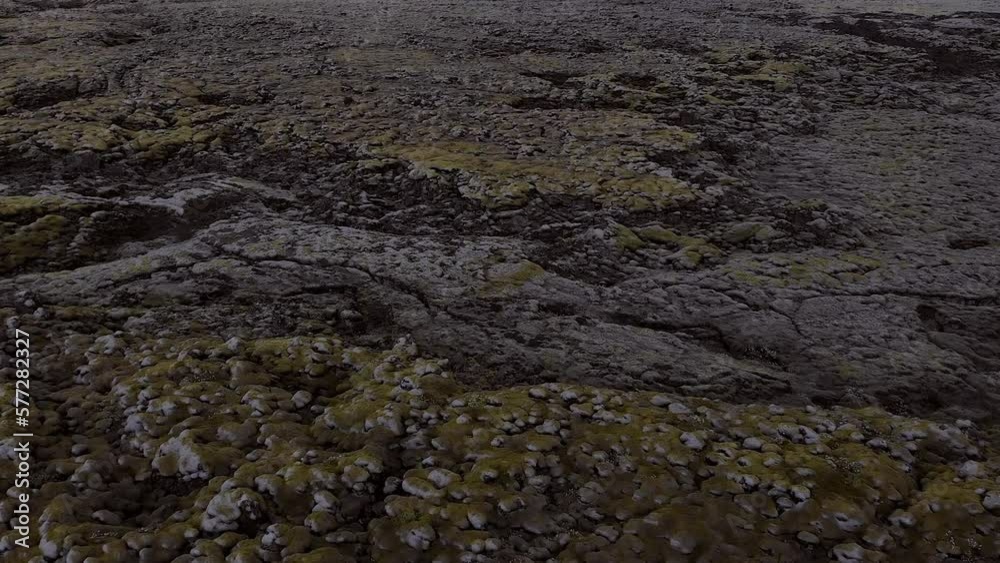 Aerial flying close over moss covered lava rocks in Iceland Aerial flying close over moss covered lava rocks in Iceland