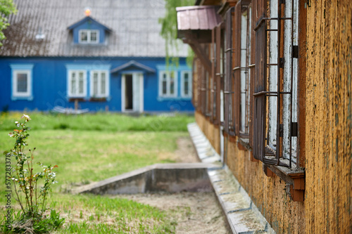 Wooden houses of Osiedle "Przyjaźń" in Warsaw surrounded by summer greenery