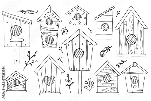 Set of wooden bird houses of different shapes and sizes. Outline drawing with a black line. Hand-drawn doodle, isolated on white background.