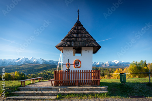 Landscape with a chapel and snow-covered Tatra Mountains in Lapszanka, Łapszanka, Malopolskie, Poland photo