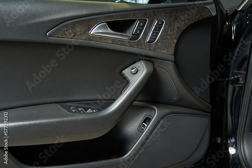 premium car door trim with built-in speakers door lock and unlock buttons, handles, mirror adjustments, seat position memory buttons