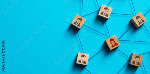 Organization structure, social network and teamwork concept on blue background. Business people icon on wooden cube blocks connecting network of connections