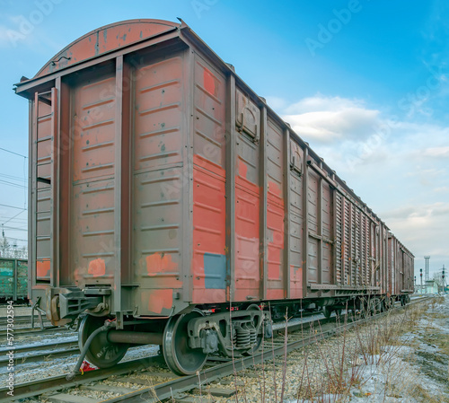 Brown, old, worn out boxcar of standard design on the rails on Trans-Siberian Railway. © vadim