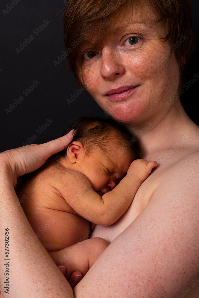 Portrait Of A Woman Holding A New Born Baby Portrait Of A Woman Holding A New Born Baby