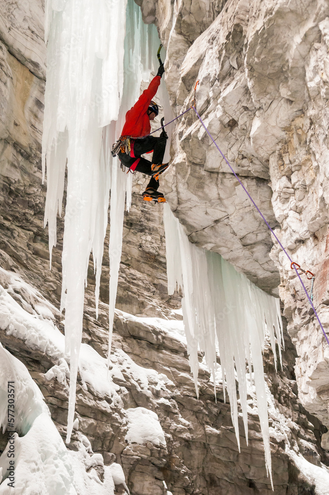 A man ice climbing in Marble Canyon, Kootenay National Park, British Columbia, Canada. A man ice climbing in Marble Canyon, Kootenay National Park, British Columbia, Canada.