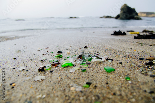 Beach glass washes ashore at Glass Beach in Fort Bragg, California. photo