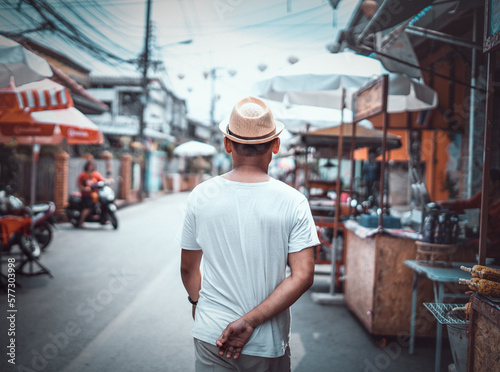 Asian Man walk in Thai market  © Phimchanok