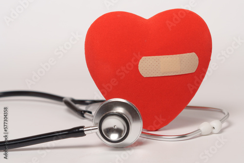 red heart with a band-aid and a stethoscope