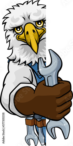 An eagle cartoon animal mascot plumber, mechanic or handyman builder construction maintenance contractor peeking around a sign holding a spanner or wrench