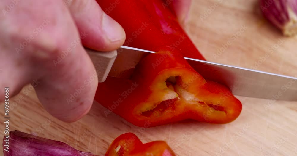 Cut red pepper on the board, red pepper to give food a hot taste Cut red pepper on the board, red pepper to give food a hot taste