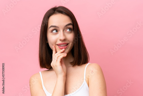 Young Ukrainian woman isolated on pink background . Portrait