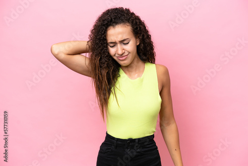Young hispanic woman isolated on pink background with neckache
