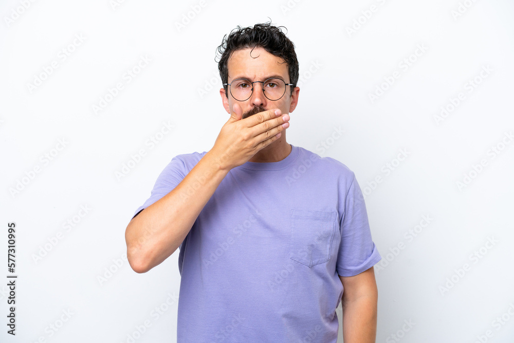 Young man with moustache isolated on white background covering mouth with hand Young man with moustache isolated on white background covering mouth with hand
