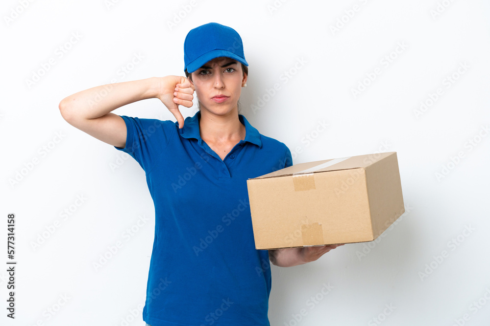 Delivery caucasian woman isolated on white background showing thumb down with negative expression Delivery caucasian woman isolated on white background showing thumb down with negative expression