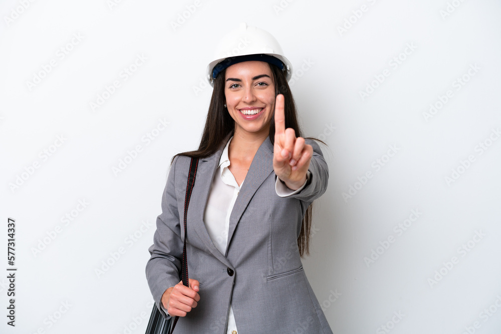 Young architect caucasian woman with helmet and holding blueprints isolated on white background showing and lifting a finger Young architect caucasian woman with helmet and holding blueprints isolated on white background showing and lifting a finger