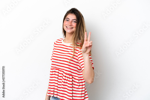 Young caucasian woman isolated on white background smiling and showing victory sign