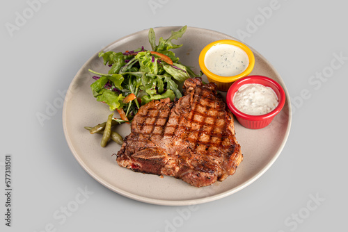 Wallpaper Mural Steak, fried meat on a plate with sauce and salad Torontodigital.ca