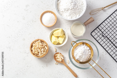 Baking ingredients and cooking utensil on marble kitchen table background