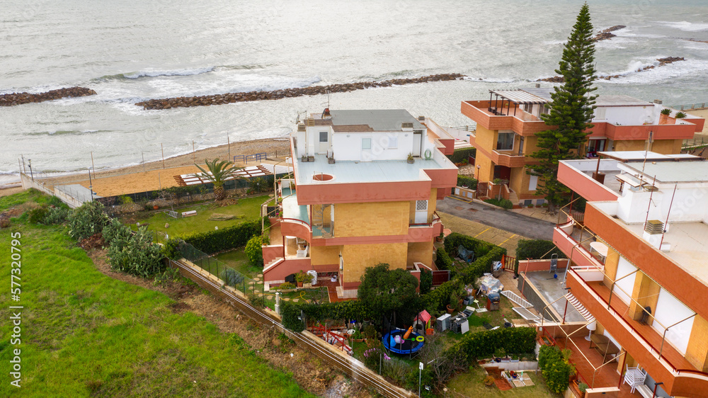 Aerial view of a residential building with sea view.