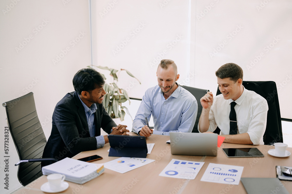 Office colleagues have a casual discussion. During a meeting in conference room, a group of business teem sit in the conference room new startup project.. Office colleagues have a casual discussion. During a meeting in conference room, a group of business teem sit in the conference room new startup project..