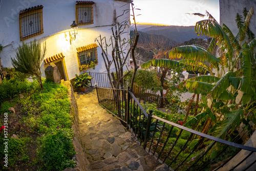 Exploring the streets of the beautiful white village of Genalguacil in Andalusia Spain at sunset during the springtime photo