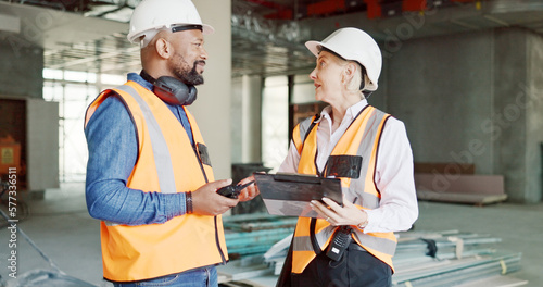 Construction, inspection and clipboard, black man and woman discussion, construction site with scaffolding and building renovation checklist. Contractor with inspector, engineering and communication.