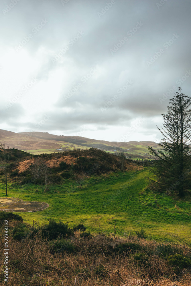 Grey cloudy sky, with rolling green hills and vegetation, Slieve Gullion, Co. Armagh,  Ring of Gullion, Northern Ireland