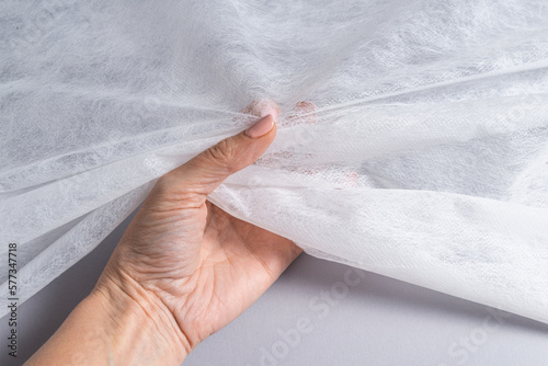 Non woven material, covering roll for medical bed