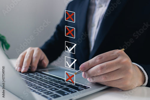 Businessman tick mark to rejected and approve document checklist.check problem solution management with QA and QC, filling out the online survey form, Answer test questions, Take an assessment photo