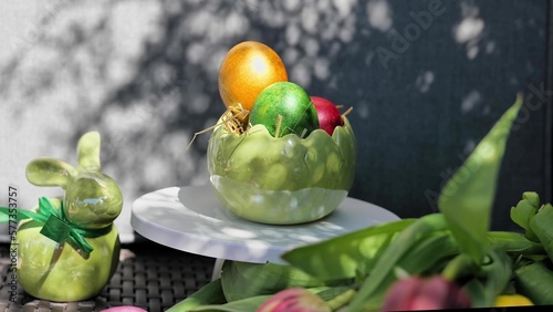 Obraz na płótnie Easter colorful eggs rotate in nest with hey outdoor in sunny warming day. w salonie