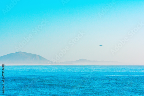  Blue sea ocean view with the mountains in horizon airplane in air  Australia Alexandra HeadlandQueensland