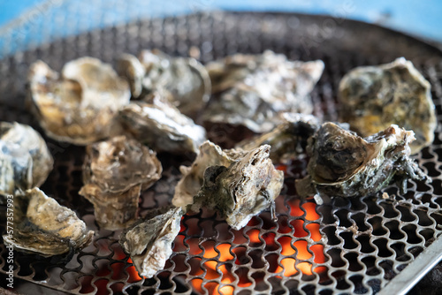 Grilled fresh oyster in Taiwan, famous street food. photo