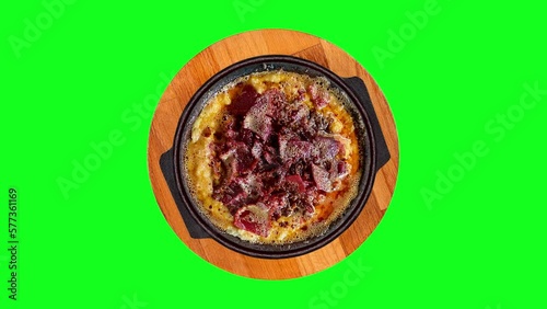 hummus dish on isolated green background