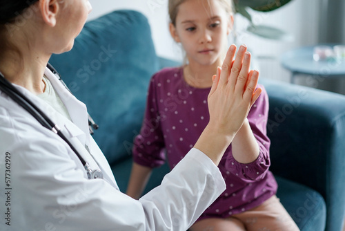 Doctor and kid patient giving Five to each other at home. Child patient at usual medical inspection. Medicine, healthcare concepts.