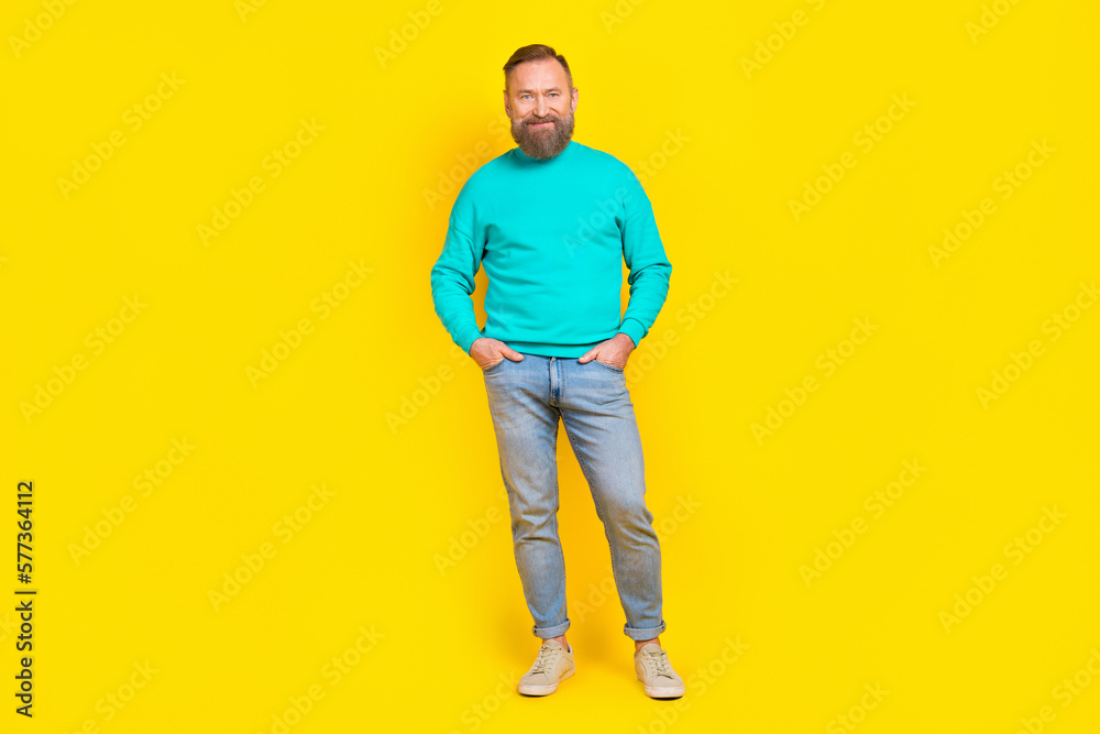 Fototapeta premium Full size photo of attractive grandpa arms pockets garment poster wear trendy aquamarine clothes isolated on yellow color background