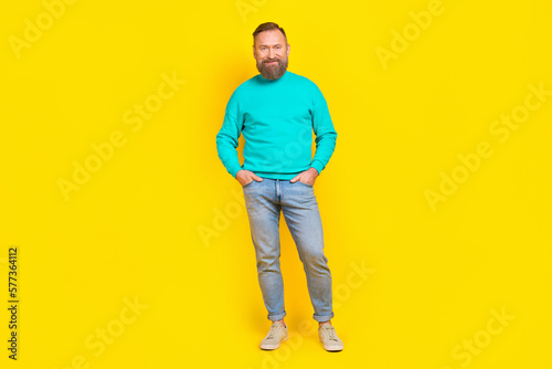 Full size photo of attractive grandpa arms pockets garment poster wear trendy aquamarine clothes isolated on yellow color background