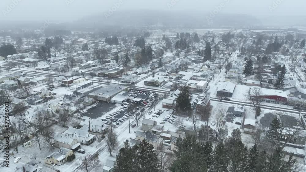 Winter Drone flight over residential area in Olean, New York. Snow is actively falling in video. Winter Drone flight over residential area in Olean, New York. Snow is actively falling in video.