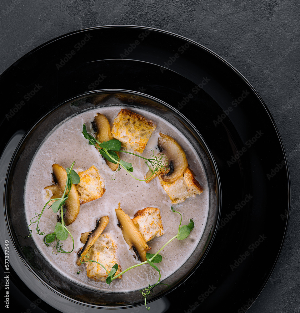 Creamy mushroom soup with champignons top view Creamy mushroom soup with champignons top view