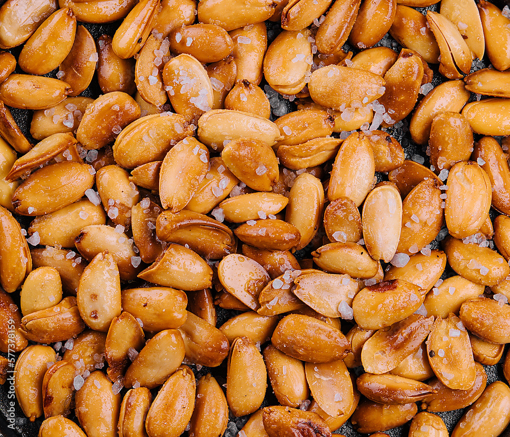 Organic roasted salty peanuts background Organic roasted salty peanuts background