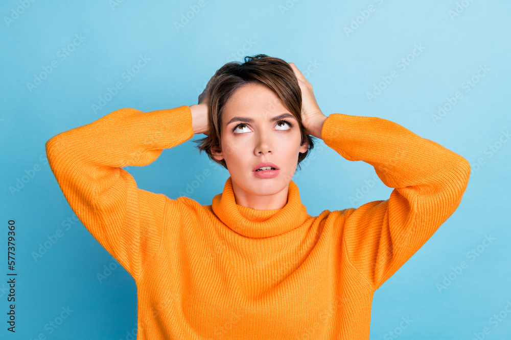 Photo of unsatisfied displeased girl arms touch head look up empty space isolated on blue color background - obrazy, fototapety, plakaty 