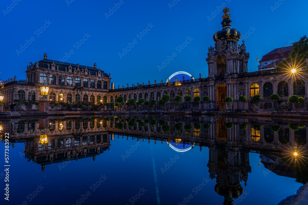 Reflection of the Dresden Zwinger in a fountain at the blue hour