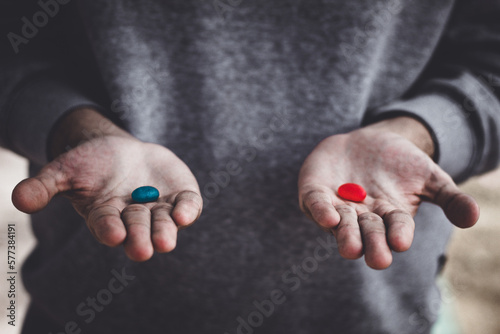 person holding pills photo