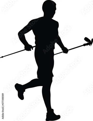 athlete skyrunner with trekking sticks running