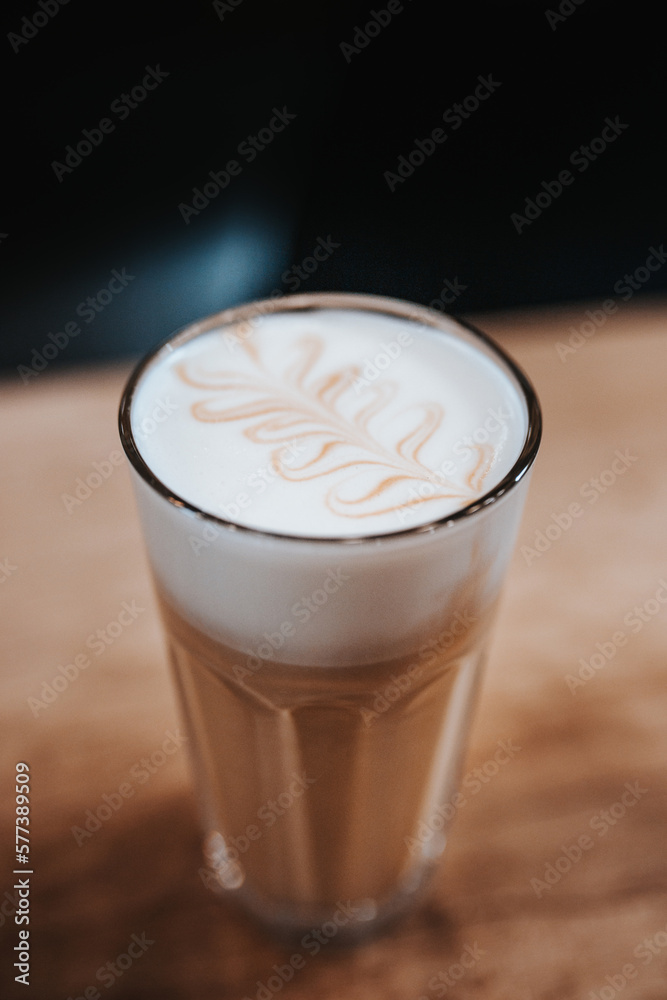 Modern equipment in a coffee shop for preparing coffee drinks - a man brews a cappuccino Modern equipment in a coffee shop for preparing coffee drinks - a man brews a cappuccino