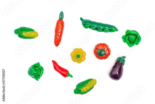 Plasticine vegetables. Corn, peas, eggplant, cabbage, pepper isolated on white. Top view. Creative Handmade vegetables. photo