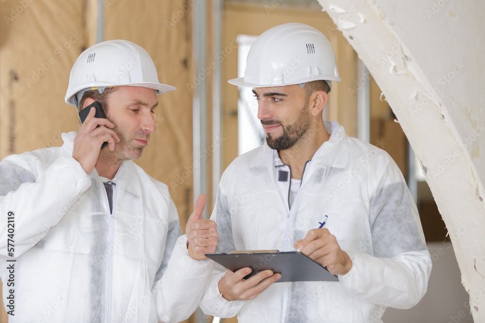 portrait of builders writing the message