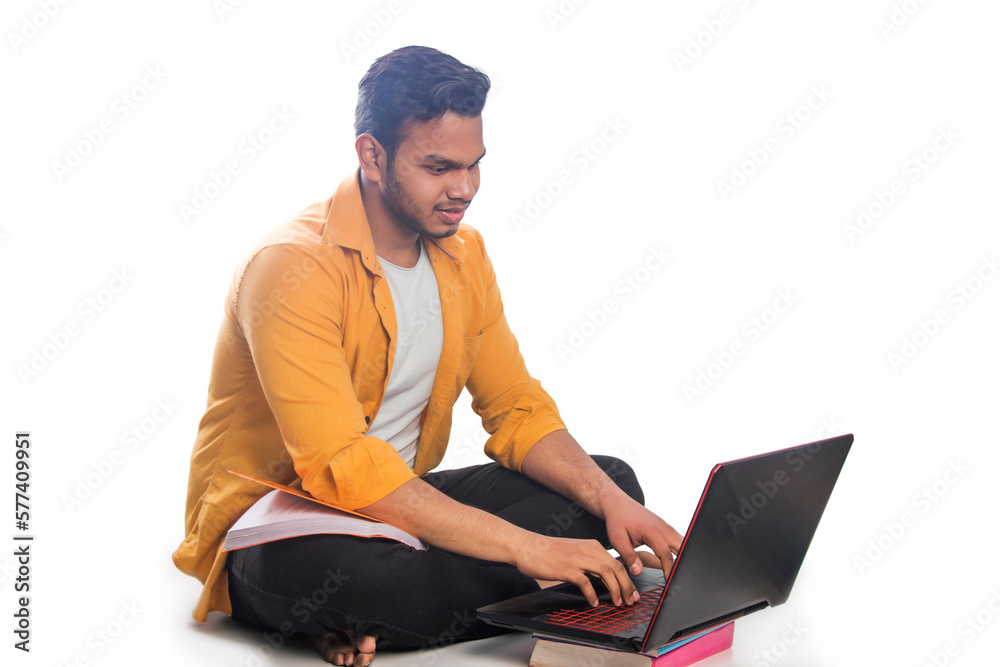 College student with a laptop while ATTENDING ONLINE CLASS College student with a laptop while ATTENDING ONLINE CLASS