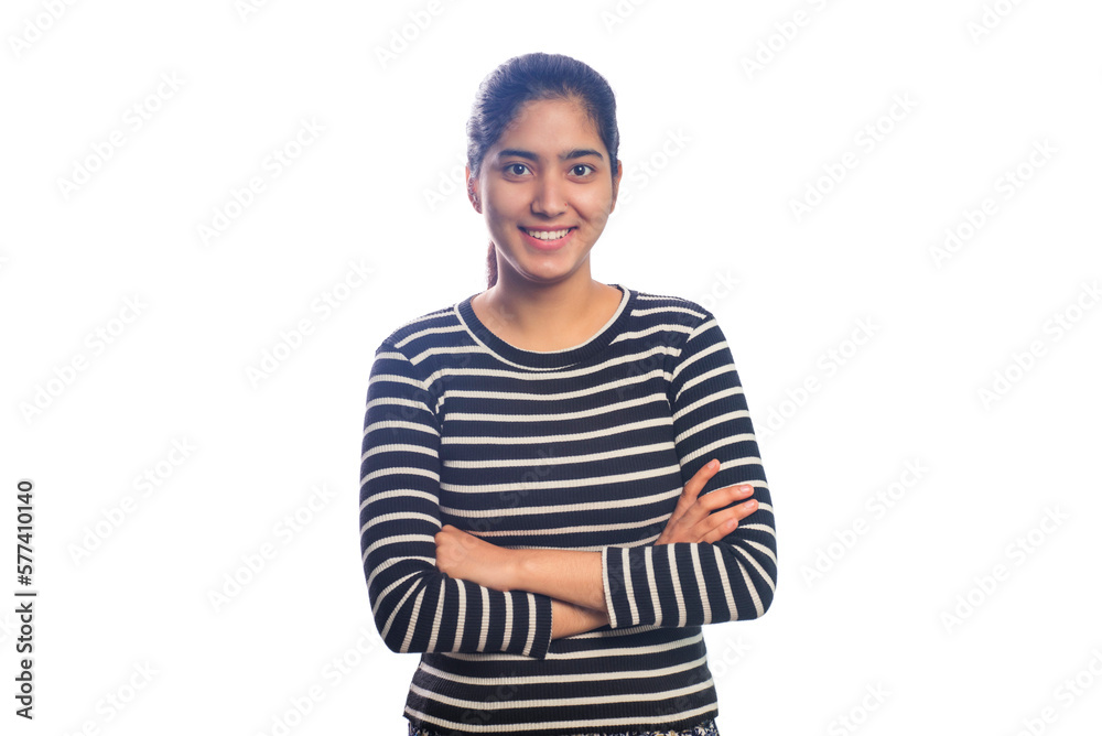 Fototapeta premium Teenage girl standing with arms crossed against white background