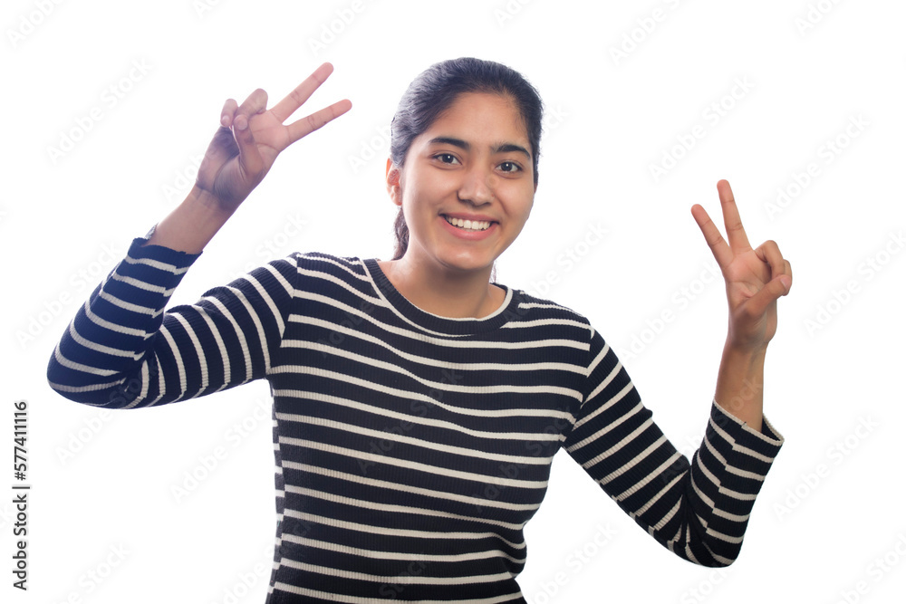 Portrait of happy young woman showing victory sign Portrait of happy young woman showing victory sign