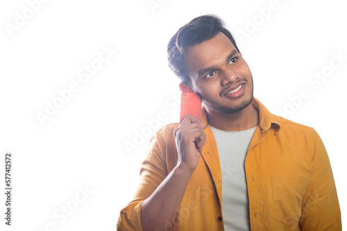 Smiling Young man holding a credit card photo